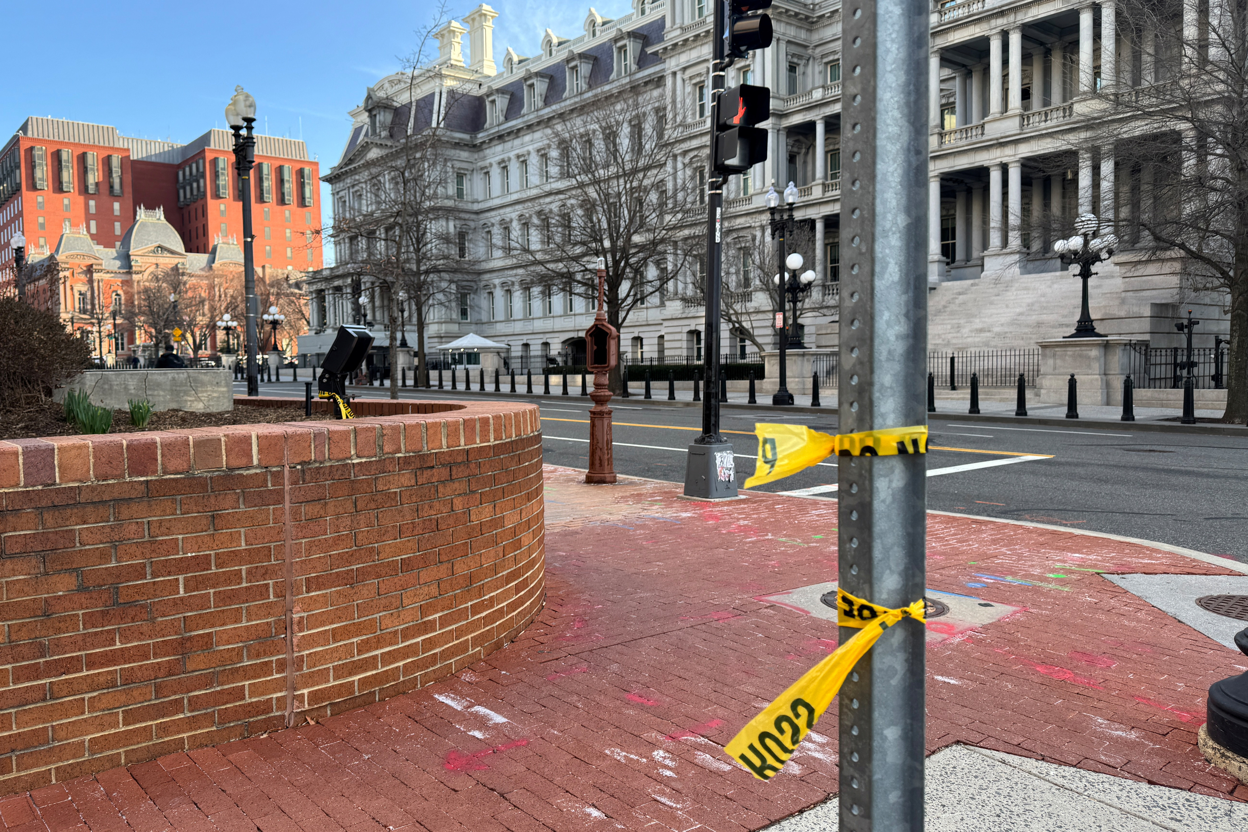 A police tape can be seen in the place of a shooting that occurred during the night near the White House complex, after the secret service reported that they shot a man who brandished a firearm in Washington, on March 9, 2025. 