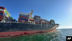 FILE - In this photo provided by Ukraine's Infrastructure Ministry Press Office, container ship Joseph Schulte leaves the port of Odesa to proceed through the corridor established for merchant vessels from Ukraine's Black Sea ports in Odesa, Aug. 16, 2023. 