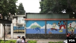 A student goes home after school by motorbike in Ho Chi Minh City. Of surveyed schoolchildren, 59% believe their homes are safe from domestic violence.