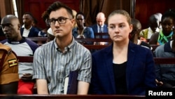 FILE: U.S. couple Nicholas Spencer and his wife Mackenzie Leigh Mathias Spencer, both 32, charged with torturing a 10-year old John Kayima, sit in a courtroom as they were freed on bail by a court in Kampala, Uganda, March 22, 2023.