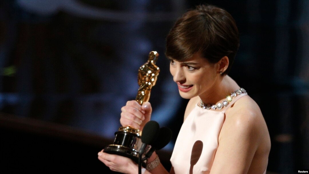 FILE - Anne Hathaway accepts the award for best supporting actress for her role in "Les Miserables" at the 85th Academy Awards in Hollywood, California, Feb. 24, 2013.