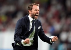 England manager Gareth Southgate celebrates after the victory over Denmark on July 7, 2021.