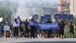 21일 미국 유타주 솔트레이크시티에서 신종 코로나 사태로 어려움을 겪고 있는 공연, 스포츠 업계 종사자들이 관심과 지원을 촉구하는 평화 행진을 했다.