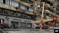 Protesting Coptic Christians block the streets near state TV building, Cairo, Egypt, Sunday, May, 15, 2011