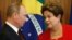 Russia's President Vladimir Putin, left, listens to Brazil's President Dilma Rousseff during a signing ceremony at Planalto presidential palace in Brasilia, Brazil, Monday, July 14, 2014.