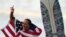 FILE - Carissa Moore of the United States celebrates winning the gold medal in the women's surfing competition, July 27, 2021, at the 2020 Summer Olympics at Tsurigasaki beach in Ichinomiya, Japan.