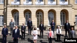 FILE - Family photo of G-7 finance ministers meeting at Lancaster House in London, Britain, June 5, 2021. 