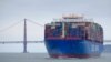 FILE - In this May 14, 2019, photo, a Cosco Shipping container ship passes the Golden Gate Bridge in San Francisco bound for the Port of Oakland.