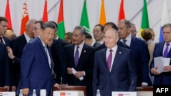 Officials, including Russian President Vladimir Putin and Chinese President Xi Jinping, attend a plenary session in the outreach/BRICS Plus format at the BRICS summit in Kazan, Russia, Oct. 24, 2024.