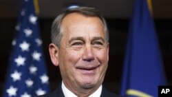 House Speaker John Boehner of Ohio smiles during a news conference on Capitol Hill in Washington, Nov. 6, 2014. 