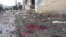 A view shows blood and bread on the ground after what activists said were missiles fired by a Syrian Air Force fighter jet from forces loyal to Syria's President Bashar al-Assad hit a bakery in Halfaya, near Hama December 23, 2012.