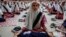 Indian Muslim students practice yoga at a school ahead of first International Yoga Day in Ahmadabad, India, Wednesday, June 17, 2015. 