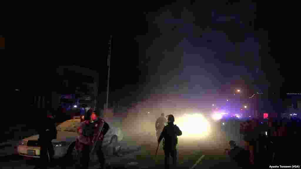 Police force protesters to leave the area near the Ferguson City Hall, in Ferguson, Missouri, Nov. 25, 2014.