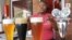 Brewer Happy Sekanka with some of her unique craft beers inside Oakes Brew House in Johannesburg. (VOA / Darren Taylor)