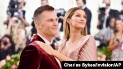 FILE - Tom Brady, left, and Gisele Bundchen attend The Metropolitan Museum of Art's Costume Institute benefit gala in New York City, May 6, 2019. 