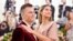 FILE - Tom Brady, left, and Gisele Bundchen attend The Metropolitan Museum of Art's Costume Institute benefit gala in New York City, May 6, 2019. 