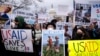 Demonstrators and lawmakers rally against President Donald Trump and his ally Elon Musk and their plans for the US Agency for International Development, which administers foreign aid approved by Congress, on Capitol Hill in Washington, Feb. 5, 2025.