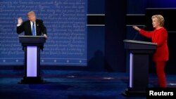 Republican presidential nominee Donald Trump and Democratic presidential nominee Hillary Clinton speak during their first presidential debate at Hofstra University in Hempstead, N.Y., Sept. 26, 2016. 