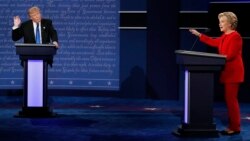 Republican presidential nominee Donald Trump and Democratic presidential nominee Hillary Clinton speak during their first presidential debate at Hofstra University in Hempstead, N.Y., Sept. 26, 2016. 