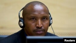 FILE - Congolese warlord Bosco Ntaganda looks on during his first appearance before judges at the International Criminal Court in the Hague, March 26, 2013. 