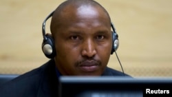 Congolese warlord Bosco Ntaganda looks on during his first appearance before judges at the International Criminal Court in the Hague, March 26, 2013. 