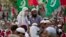 FILE - Supporters of banned sectarian group Sipah-e-Sahaba listen to their leaders at a gathering in Islamabad, Pakistan, Oct. 4, 2013. Pakistan's DAWN newspaper says that 41 of the 64 extremist organizations banned by the government operate freely online