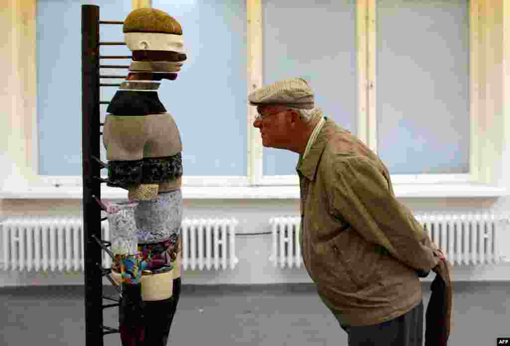 June 8: A man looks at the work "Organ Mapping" by Mariechen Danz at the Based in Berlin exhibition in Berlin. The exhibition shows the work of 80 emerging artists who live and work in Berlin. (REUTERS/Thomas Peter)