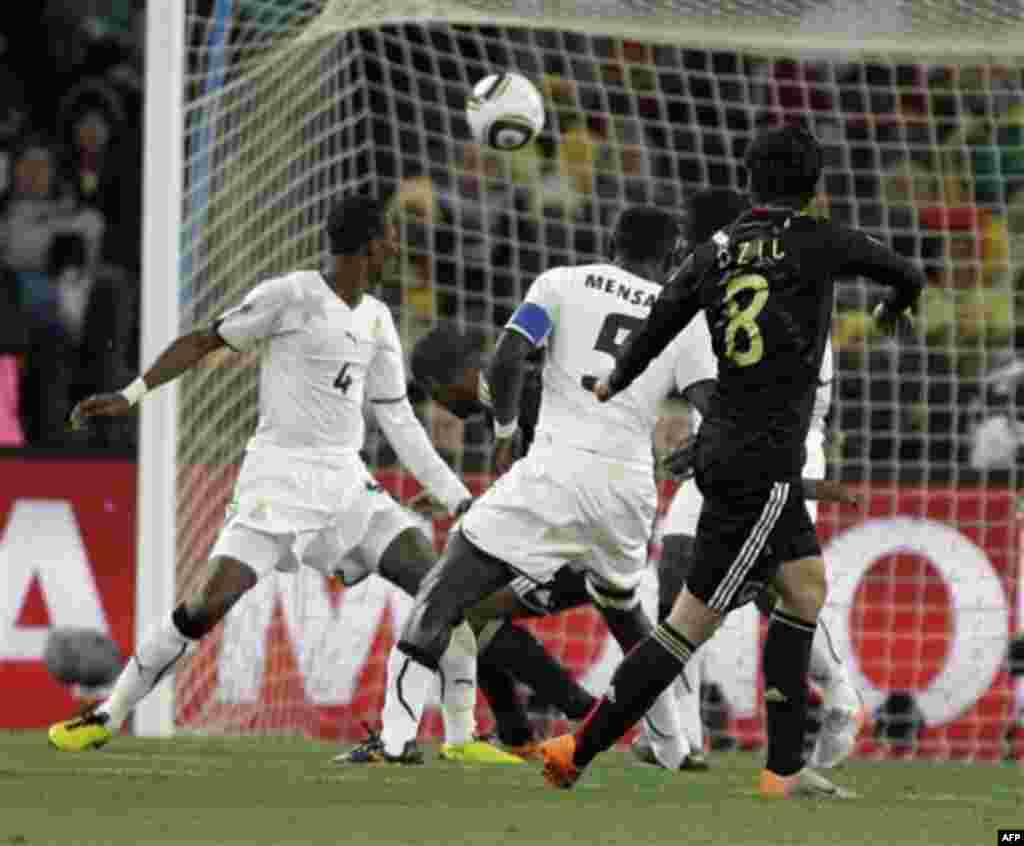 Germany's Mesut Oezil, foreground right, scores during the World Cup group D soccer match between Ghana and Germany at Soccer City in Johannesburg, South Africa, Wednesday, June 23, 2010. (AP Photo/Matt Dunham)