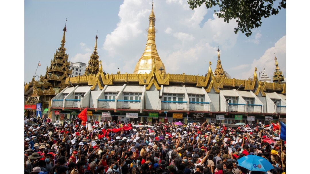 People rally in a protest against the military coup and to demand the release of elected leader Aung San Suu Kyi, in Yangon, Myanmar, Fe. 7, 2021.