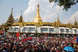 People rally in a protest against the military coup and to demand the release of elected leader Aung San Suu Kyi, in Yangon, Myanmar, Fe. 7, 2021.