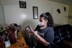 FILE - Roxanne Schaefer is pictured in her apartment in West Warwick, R.I., July 27, 2021. Schaefer, months behind on rent, was bracing for the end of a federal residential eviction moratorium at midnight Saturday.