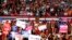 Supporters waves signs as President Donald Trump speaks at a rally, Nov. 3, 2018, in Pensacola, Florida.