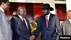 Leader of the Sudan People's Liberation Movement in Opposition (SPLM-IO) Riek Machar shakes hands with South Sudan's President Salva Kiir after a tripartite summit at the State House in Entebbe, Uganda, Nov. 7, 2019.