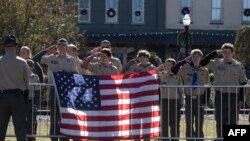 Boy Scouts react while watching the procession following a funeral service for former US First Lady Rosalynn Carter, at Maranatha Baptist Church in Plains, Georgia, on November 29, 2023.