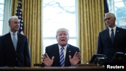 FILE - President Trump reacts to the AHCA health care bill being pulled by Congressional Republicans before a vote as he appears with Secretary of Health and Human Services Tom Price (L) and Vice President Mike Pence (R) in the Oval Office of the White House in Washington, March 24, 2017. 