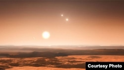 The view from one of the newly identified planets would be spectacular. They orbit the fainter of the three stars in the system, and the other two stars would be visible in the daytime. (Credit: ESO)