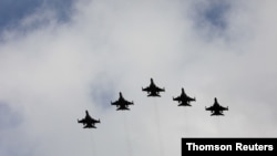 IDF aircraft fly in formation during an inauguration ceremony of a maintenance centre for F-16 fighter jets, in Taichung