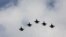 IDF aircraft fly in formation during an inauguration ceremony of a maintenance centre for F-16 fighter jets, in Taichung