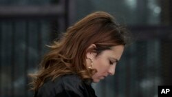 FILE - Egyptian lawyer Ragia Omran waits to speak during a trial session of activists facing charges on organizing unauthorized protests, at a courtroom in Cairo, Egypt, Dec. 4, 2014.