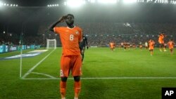 Ivory Coast's Franck Kessie celebrates after converting the winning goal in a penalty shootout against Senegal at 2023 African Cup of Nations, at the Charles Konan Banny stadium in Yamoussoukro, Ivory Coast, Saturday, January 20, 2024.