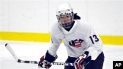 FILE - Julie Chu scrimmages with the U.S. Women's National Hockey team, National Sports Center, Blaine, Minnesota, Aug. 20, 2009.