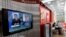 A television screen shows former U.S. spy agency contractor Edward Snowden during a news bulletin at a cafe at the Moscow's Sheremetyevo airport, Russia, June 26, 2013.