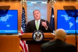 FILE - U.S. Secretary of State Mike Pompeo speaks during a press briefing at the State Department, in Washington, May 20, 2020.