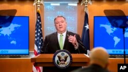 FILE - U.S. Secretary of State Mike Pompeo speaks during a press briefing at the State Department, in Washington, May 20, 2020. 