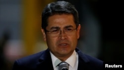 Honduras' President Juan Orlando Hernandez speaks to the media after his arrival at Mariscal Sucre Airport in Quito, Ecuador, May 23, 2017, ahead of Ecuadorean president inauguration.