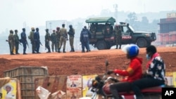 FILE - Security forces gather on election day in Kampala, Uganda, Jan. 14, 2021. Authorities in Uganda recently suspended 54 aid groups, but those groups say they are being targeted for political reasons.
