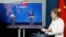 German Chancellor Angela Merkel, right, speaks as she holds a video news conference with European Council President Charles Michel, right on screen, and European Commission President Ursula von der Leyen, in Berlin, Sept. 14, 2020. 