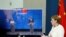 German Chancellor Angela Merkel, right, speaks as she holds a video news conference with European Council President Charles Michel, right on screen, and European Commission President Ursula von der Leyen, in Berlin, Sept. 14, 2020. 