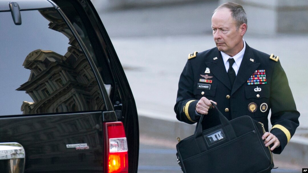 National Security Agency Director General Keith Alexander leaves the White House in Washington, Oct. 2, 2013.