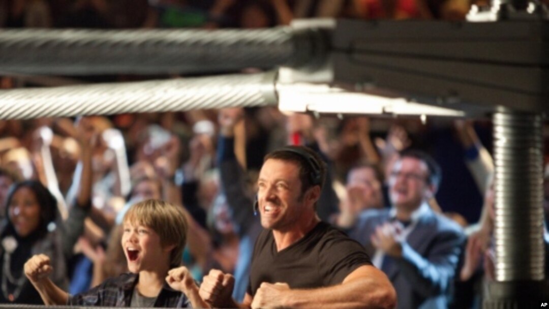 Hugh Jackman and Dakota Goyo star as a father and son who reconnect with the help of a prize-fighting robot in "Real Steel."